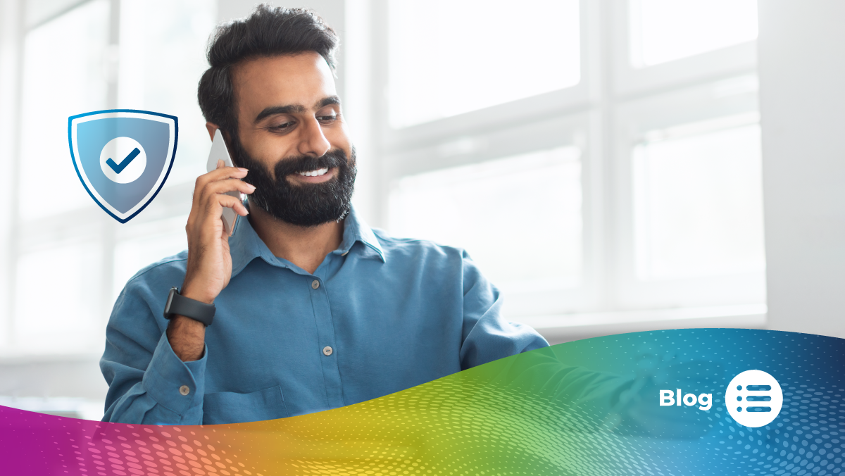 Man smiling while talking on a smartphone, representing trust and communication.